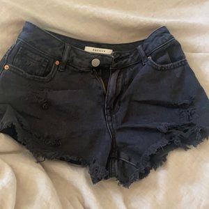 Black jean shorts with holes and pockets